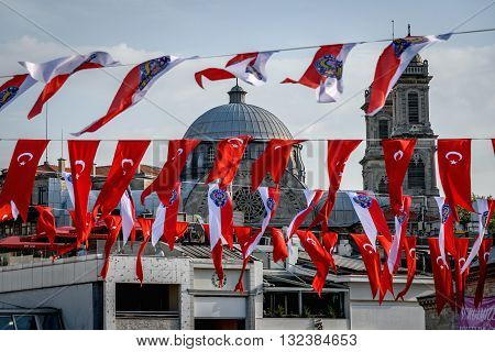 Turkish flags obscecurring the view of mosque in Istanbul Turkey