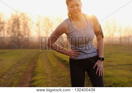 Side stitch - woman runner side cramps