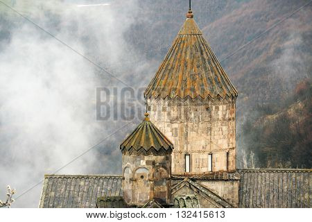 Ancient monastery Tatev covered with clouds in the mountains of Armenia. Was founded in year 906. 