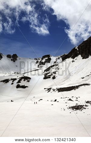 Hikers In Snowy Mountains