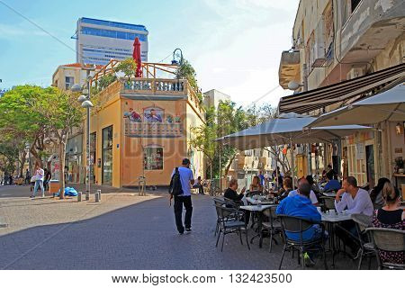 TEL AVIV, ISRAEL - APRIL 3, 2016: People at outdoor cafe at Nahalat Binyamin district, Tel Aviv, Israel. Selective focus.