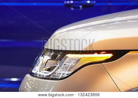 Cars body detail by night. Vehicle lights. Horizontal format