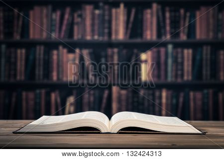 Bookshelf and heavy books on the wood table