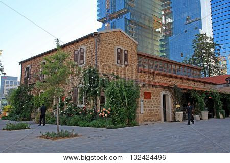 TEL AVIV, ISRAEL - APRIL 7, 2016: Old and modern buildings at dusk at the Sarona district, Tel Aviv, Israel. Recently open Sarona Market became the most popular place in Tel Aviv.