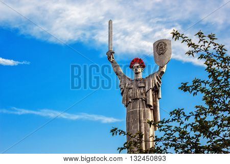 KIEV, UKRAINE - MAY 09: The Motherland Monument also known as Rodina-Mat', decorated with red poppy flower wreath on Victory Day, devoted the Great Patriotic War. May 09, 2016 in Kiev, Ukraine