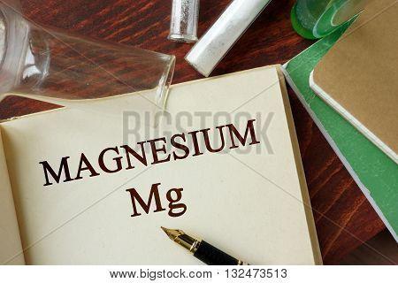 Magnesium written on a page. Chemistry concept.