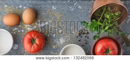 Ingredients for backed eggs with tomatoes wide screen