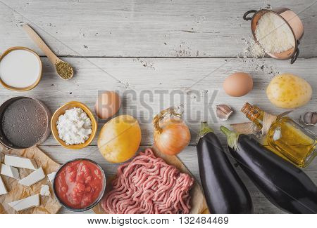 Ingredients for moussaka on the white wooden table top view