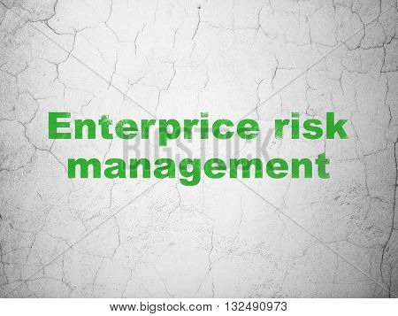 Business concept: Green Enterprice Risk Management on textured concrete wall background