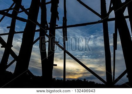 Black silhouette of the wooden bridge in Kanjanaburi province, Thailand