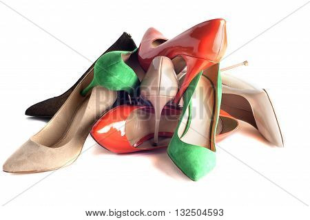 bright multicolored female shoes on high heels isolated on white background