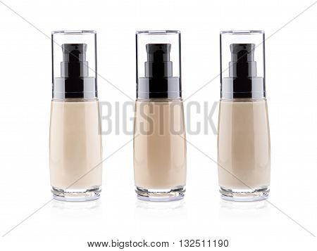 set of liquid foundation in the bottle isolated on a white