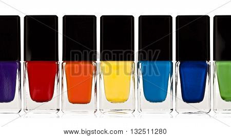 Set of colorful nail polish isolated on white