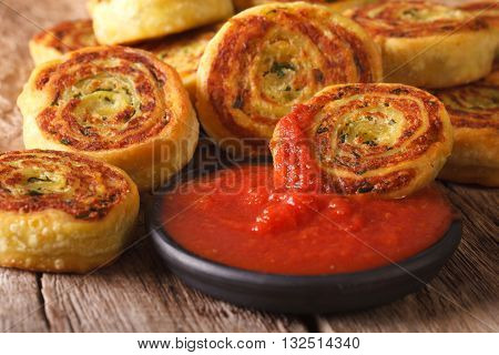 Tasty Sliced Potato Rolls With Tomato Chutney Close-up. Horizontal