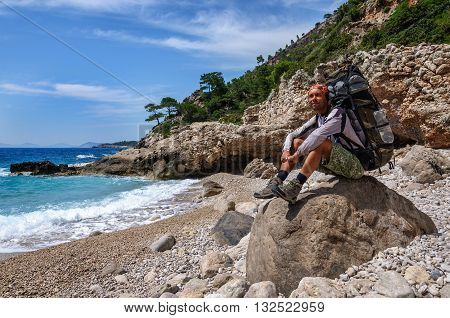Hiking in Turkey. Lycian Way. Backpacker by the sea. 