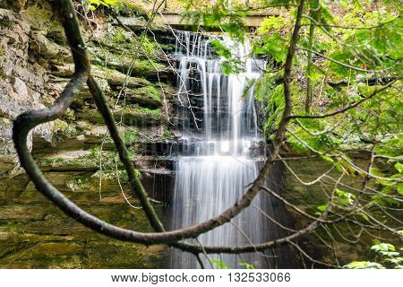 Memorial Falls surrounded by lush green foliage at Pictured Rocks National Lakeshore in Munising Michigan