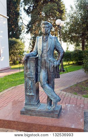Sochi, Russia - February 10, 2016: Monument to the Great Russian poet Alexander Pushkin near library building