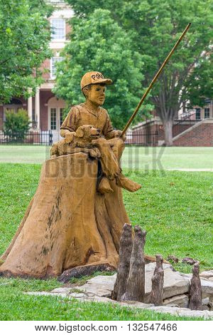 Boy And Dog Fishing Sculpture At Theta Pond