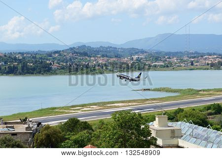 KERKYRA GREEES - MAY 14: The aircraft of Ryanair Airlines taking off in Corfu International Airport on May 14 2016 in Kerkyra Greece. Up to 16 mln tourists is expected to visit Greece in year 2016.