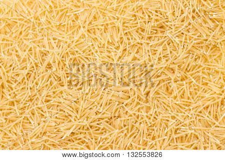 Raw vermicelli pasta background. Pasta Vermicelli texture background. Traditional Italian food.