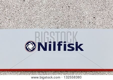 Haderslev, Denmark - May 29, 2016: Nilfisk sign on a wall. Nilfisk is a supplier of professional cleaning equipment in both industrial, commercial and consumer markets