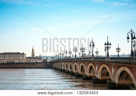 Bordeaux river bridge with St Michel cathedral, France