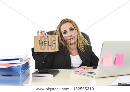 frustrated attractive businesswoman in her 40s holding help sign desparate suffering stress overworked and overwhelmed working at office laptop computer in sad and worried face expression