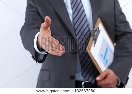 Young Businessman giving hand for an handshake