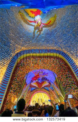 KOLKATA INDIA - OCTOBER 18 2015 : Night image of decorated Durga Puja pandal shot at colored light at Kolkata West Bengal India. Durga Puja is biggest religious festival of Hinduism.