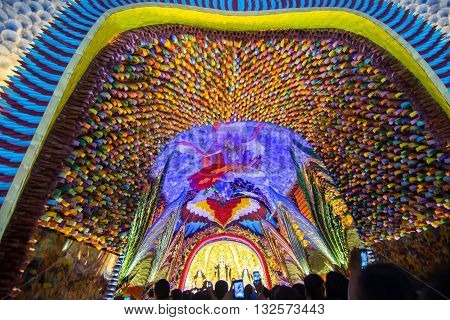 KOLKATA INDIA - OCTOBER 18 2015 : Night image of decorated Durga Puja pandal shot at colored light at Kolkata West Bengal India. Durga Puja is biggest religious festival of Hinduism.