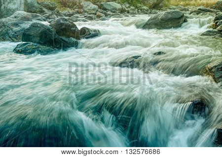 Beautiful Reshi River water flowing through stones and rocks at dawn Sikkim India. Reshi is one of the most famous rivers of Sikkim flowing through the state and serving water to many local people.