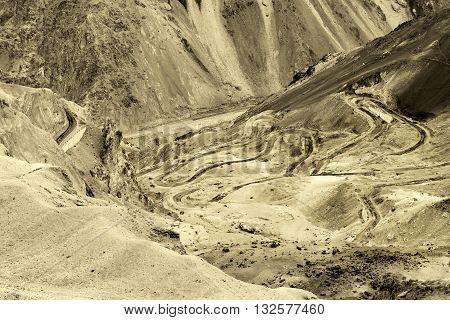 Aerial view of Zigzag road - famously known as jilabi road at old route of Leh Srinagar Highway Ladakh Jammu and Kashmir India. Sepia tinted beautiful stock image
