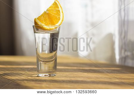 Tequila shot with orange with copypaste space