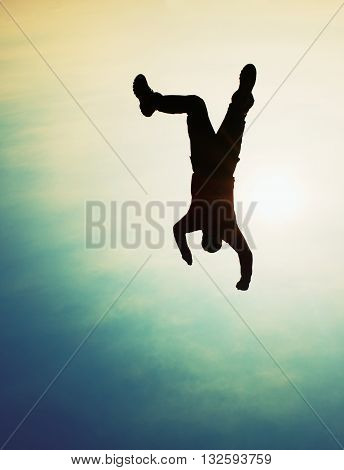 Flying Man. Young Man Falling Down On Sky Background.