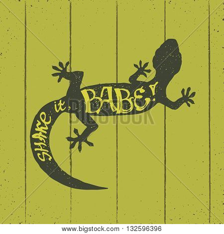 hand drawn silhouette of flexible gecko sitting on a wooden wall