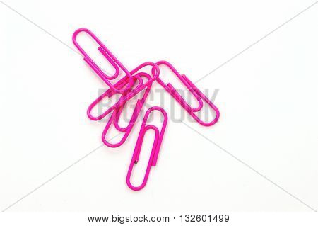Pink paper clip isolated on white background