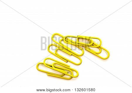 Yellow paper clip isolated on white background