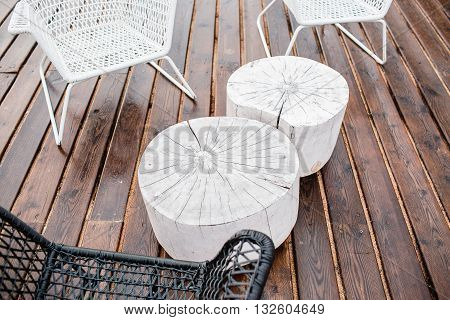 Table set of open-air restaurant, on beach, summer rain