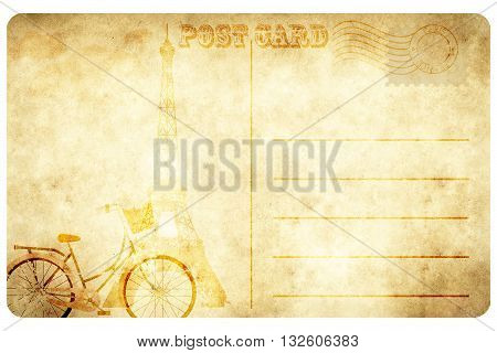 Vintage paper background with Eiffel towerpostal stampbicycle and space for the text. Old postcard design.