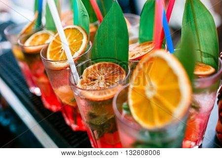 Colorful cocktails close up. an open-air party. after the rain. on the beach