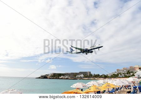 Plane Above Beach Water