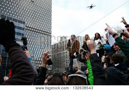 NEW YORK-JAN 12: Charlie Todd, founder of Improv Everywhere, speaks at the 13th annual international 'No Pants Subway Ride' at Foley Square January 12, 2014 as drone hovers overhead in New York City.
