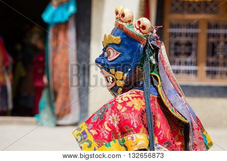 LAMAYURU INDIA - JUNE 13 2015: Unidentified buddhist lamas dressed in mystical mask dancing Tsam mystery dance in time of Yuru Kabgyat Buddhist festival at Lamayuru Gompa Ladakh North India