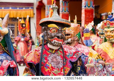 LAMAYURU INDIA - JUNE 13 2015: Unidentified buddhist lamas dressed in mystical mask dancing Tsam mystery dance in time of Yuru Kabgyat Buddhist festival at Lamayuru Gompa Ladakh North India
