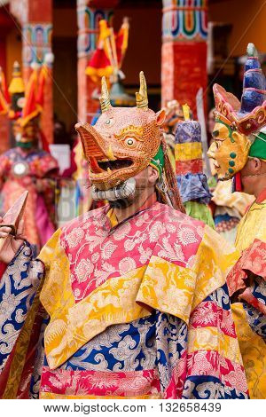 LAMAYURU INDIA - JUNE 13 2015: Unidentified buddhist lamas dressed in mystical mask dancing Tsam mystery dance in time of Yuru Kabgyat Buddhist festival at Lamayuru Gompa Ladakh North India