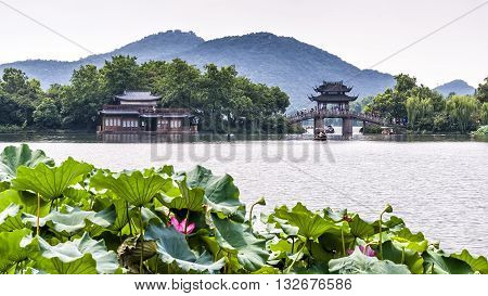 Hangzhou, China - August 14, 2011: Scenic view of Yudai Bridge On West Lake. West Lake has influenced poets and painters throughout Chinese history for its natural beauty and historic relics.