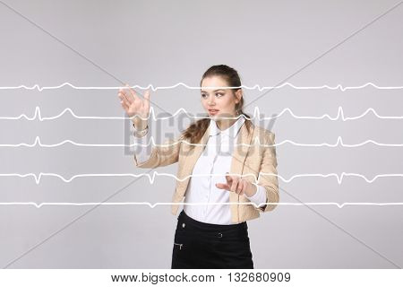 Doctor woman working with cardiogram lines