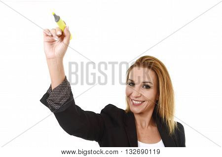 business portrait of attractive blond successful businesswoman holding marker writing or pointing to transparent glassboard screen isolated in white smiling happy and confident with copy space