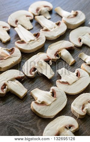 Cut edible mushrooms settled into geometrical patterns