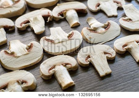 Cut edible mushrooms settled into geometrical patterns